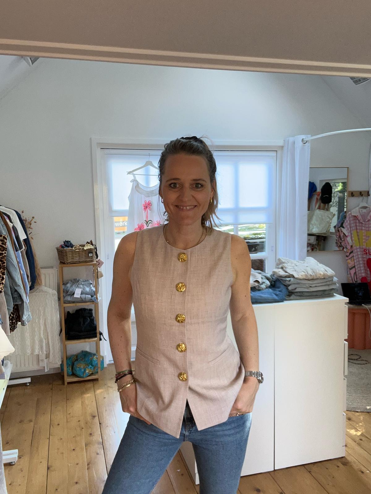 Gilet gouden knoop
