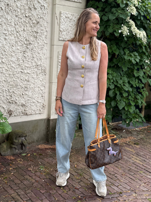 Gilet gouden knoop