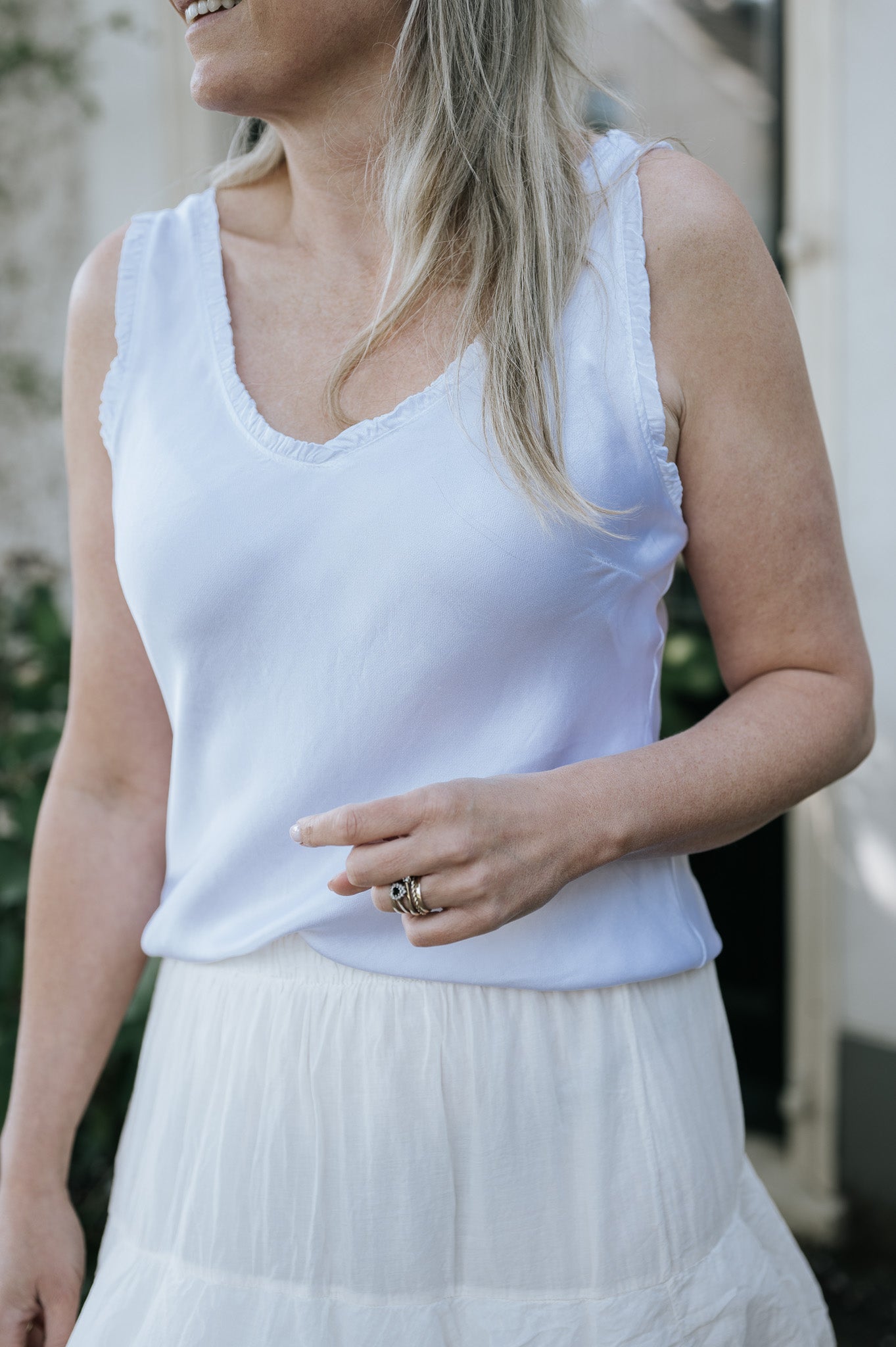 Top met glans in wit en brons