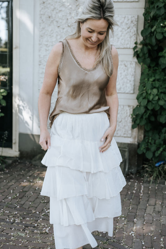 Top met glans in wit en brons